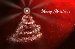 Et billede af et juletræ på rød baggrund til at sende gratis julekort og sprede juleglæde.